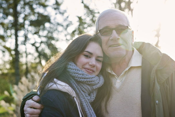 Portrait of grandfather and granddaughter, outdoors - Фото, изображение