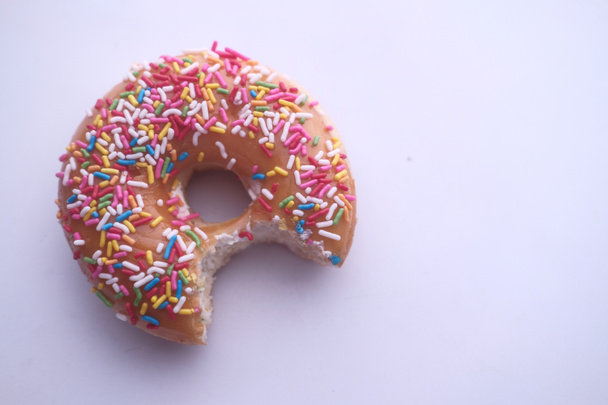 close up of donut with mouth bite  - Zdjęcie, obraz