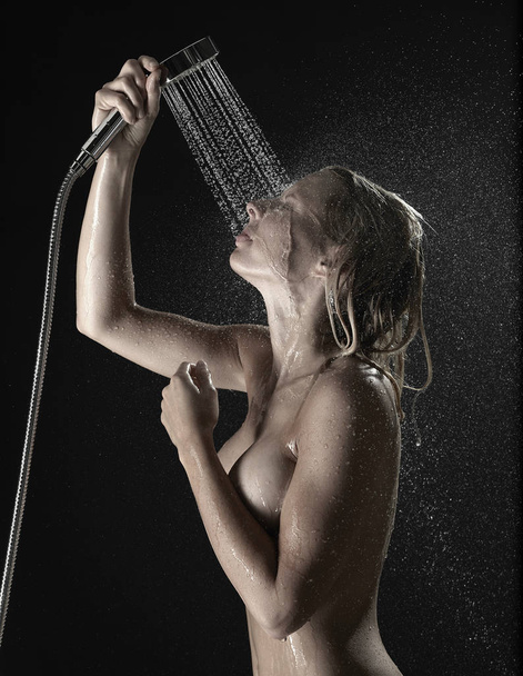 Woman taking a shower - Фото, зображення