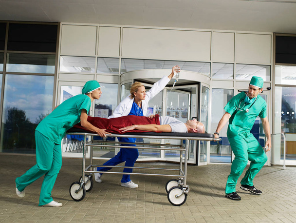 Medical team in front of hospital - Фото, изображение