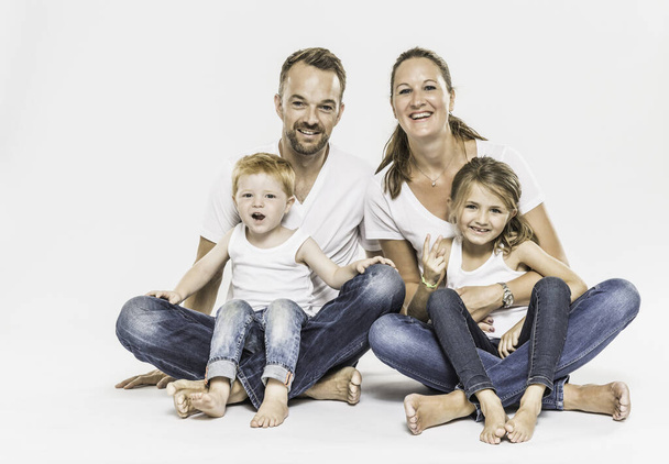 Portrait of young family, smiling - Fotó, kép