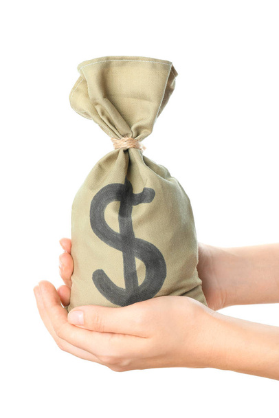 Mãos femininas segurando saco com dinheiro no fundo branco
 - Foto, Imagem