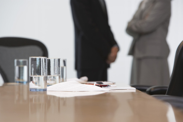 Business couple standing by conference table - Photo, Image