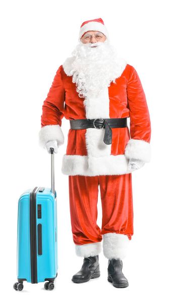 Санта-Клаус с багажом на белом фоне. Концепция отпуска
 - Фото, изображение