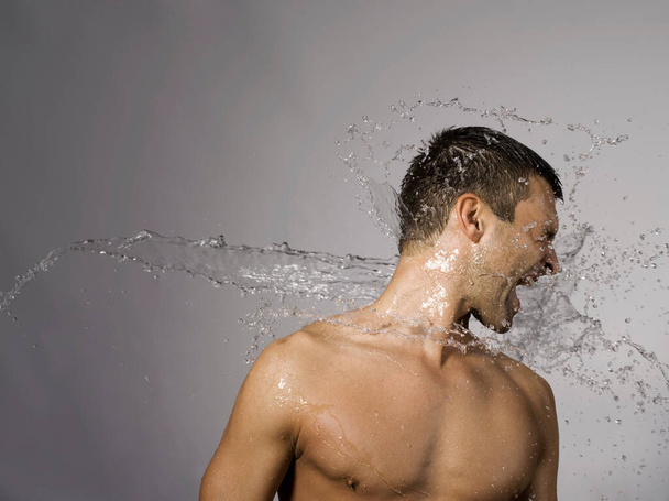 Man splashed with water - Foto, immagini