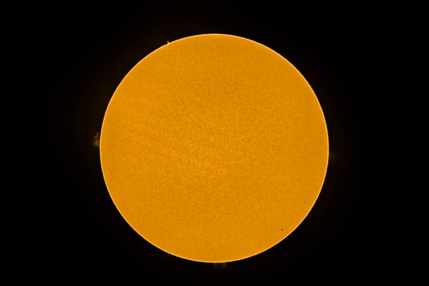 An amazing astronomical event, Planet Mercury transit over the Sun surface, 11th November 2019. We can see the tiny size of Mercury compare to the Sun disk and Sun flares on an H Alpha telescope view - Foto, Imagem