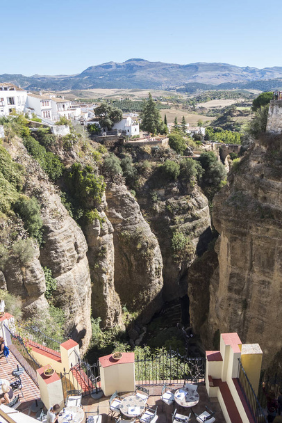 View from the new Bridge over Guadalevin River in Ronda, Malaga, Spain. Popular landmark in the evening - Foto, afbeelding