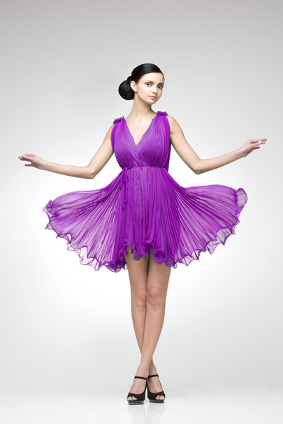 brunette in purple dress - Φωτογραφία, εικόνα