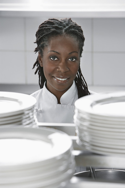 Chef standing near plates - 写真・画像