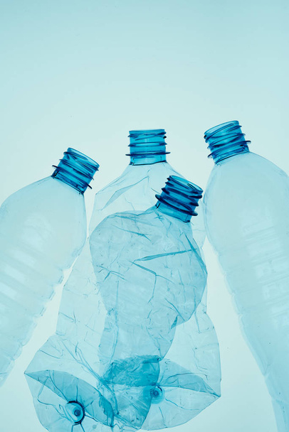 Empty plastic squashed bottles collected to recycling - Foto, Imagen