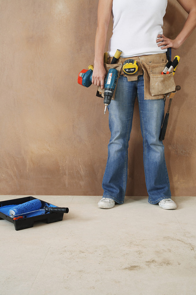 Woman with toolbelt and drill - Foto, imagen