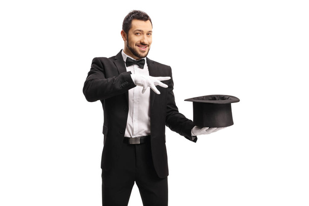 Magician making a magic trick with a top hat  - Foto, Imagem