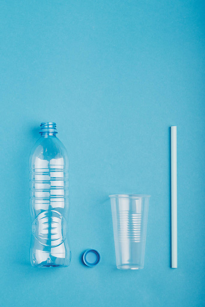 Empty plastic bottle, cup, straw and cap collected to recycling - Foto, afbeelding