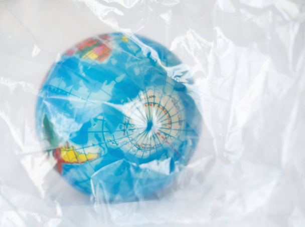 globe wrapped in a plastic bag - Photo, Image