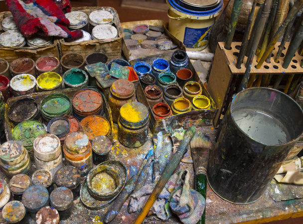 Artistic paintbrushes, paints and palette knifes  - Фото, изображение