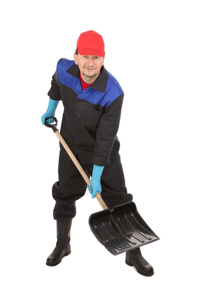 Man holds black shovel. - Фото, изображение