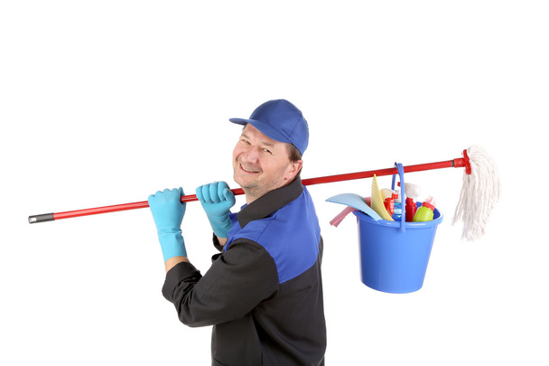 Man holding cleaning supplies. - 写真・画像