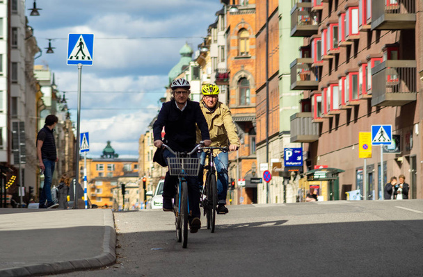 April 22, 2018, Stockholm, Sweden. Cyclists on one of the streets in Stockholm. - Photo, image