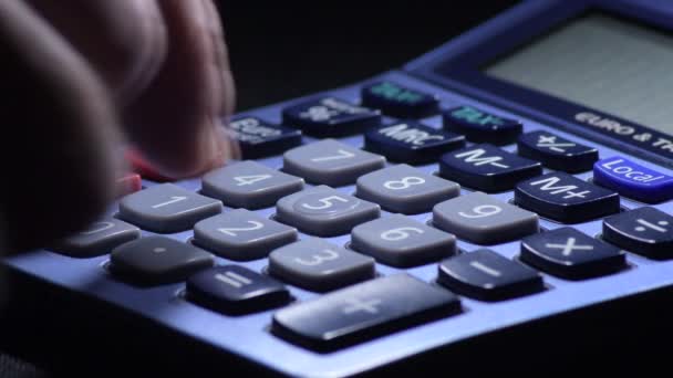 Calculating Costs with a domestic calculator - Footage, Video