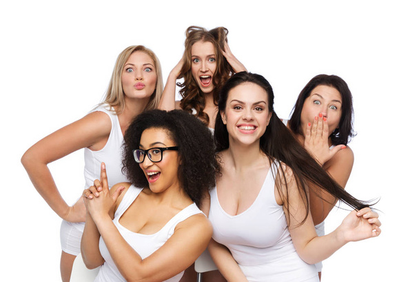 friendship, beauty, body positive and people concept - group of happy plus size women in white underwear having fun and making faces - Foto, imagen