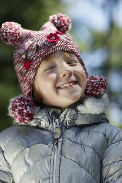 Girl  in winter clothes smiling - Zdjęcie, obraz