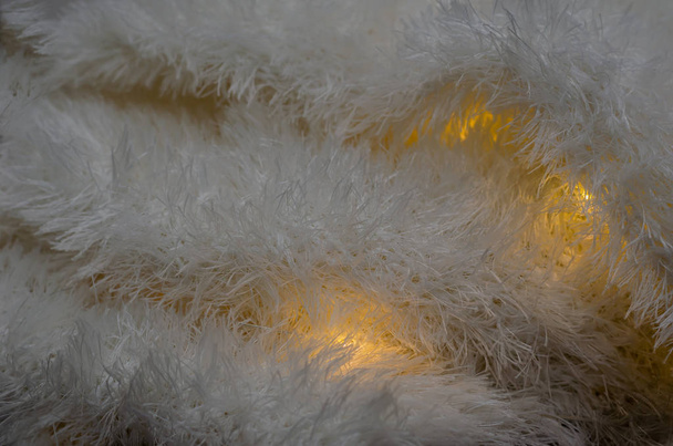 Warm upholstered fabric with luminous pantyhose. - Photo, Image