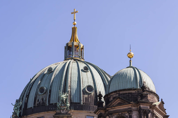 main dome and side dome of the berlin cathedral with gilded cross - Fotografie, Obrázek
