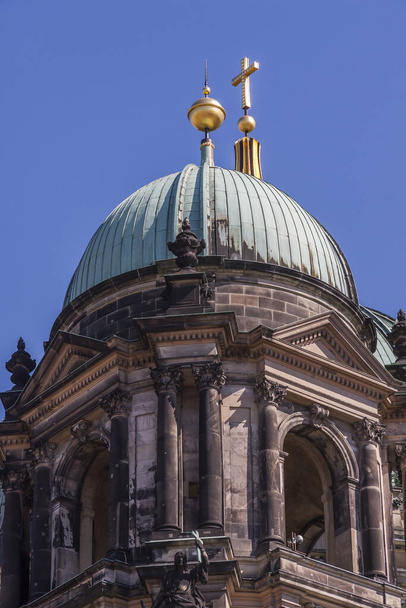 side dome of the berlin cathedral with the gilded final cross of the main dome - Photo, Image