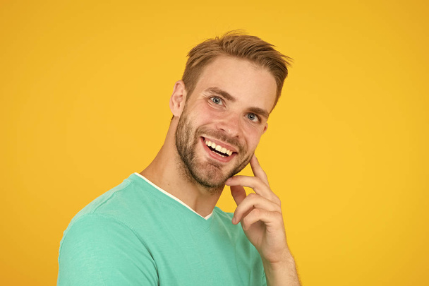 Barber hairdresser salon. Bearded man. Skin care. Facial care. Keep youth. Kind smile. Self care. Handsome man yellow background. Well groomed guy with bristle and nice hairstyle. Male beauty - Foto, afbeelding