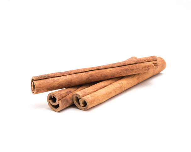 Studio shot three cinnamon stick barks isolated on white - Photo, Image