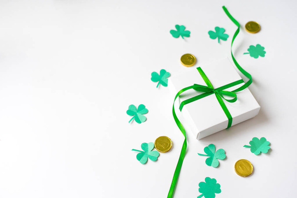 Gift box with a green bow, happy Shamrock, chocolate coins-St. P - Photo, Image