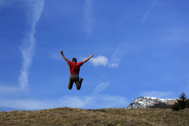 man jumps into the air - Фото, изображение
