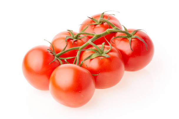 Ripe fresh tomatoes on branch on a white background. - Фото, изображение