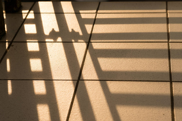 detail of bakon railings as shadows on tiles and joints - Photo, image