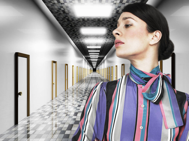 Attractive middle aged woman in corridor - 写真・画像