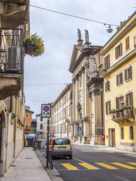 Verona, Italy, on April 24, 2019. Narrow picturesque street in the old town. Typical city skyline - 写真・画像