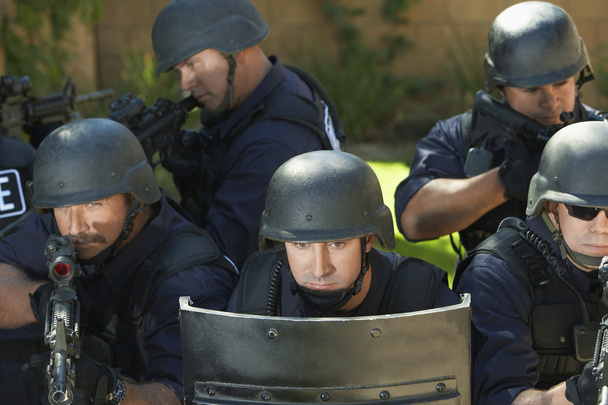 Officers behind shield - Fotoğraf, Görsel