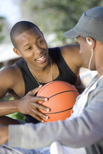 Two African American young men talking to each other - Foto, imagen