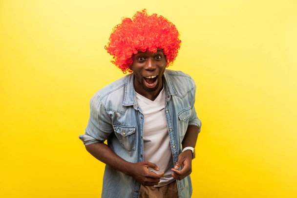 Portrait of enthusiastic funny crazy carefree man wearing red cu - Valokuva, kuva