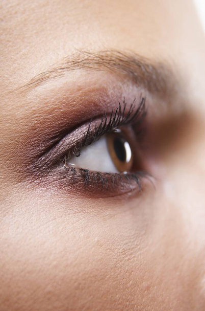 Detail image of woman's eye looking away - Foto, imagen