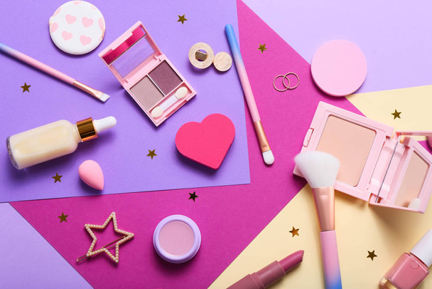Set of professional decorative cosmetics, makeup tools and accessory on colorful background. Beauty, fashion and shopping concept. Flat lay composition, top view - Photo, Image