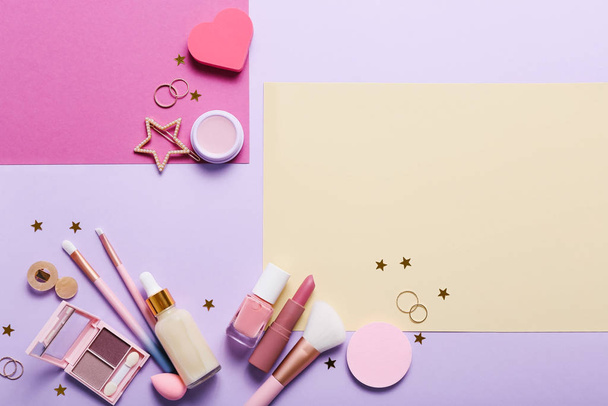 Set of professional decorative cosmetics, makeup tools and accessory on colorful background. Beauty, fashion and shopping concept. Flat lay composition, top view - 写真・画像