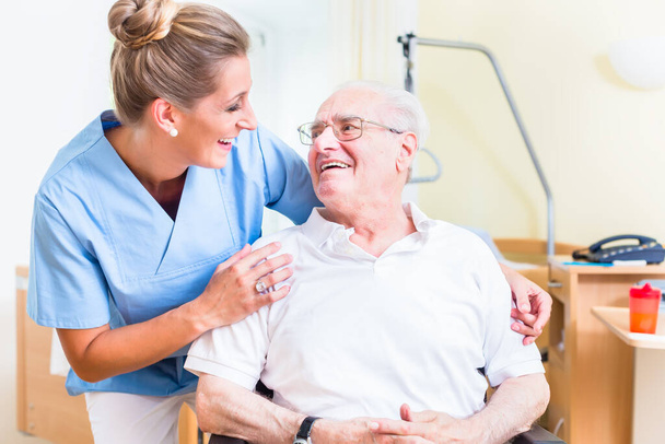 Senior man and old age nurse in nursing home - Foto, immagini