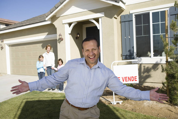 Portrait of mid-adult man in front of new house - Photo, Image