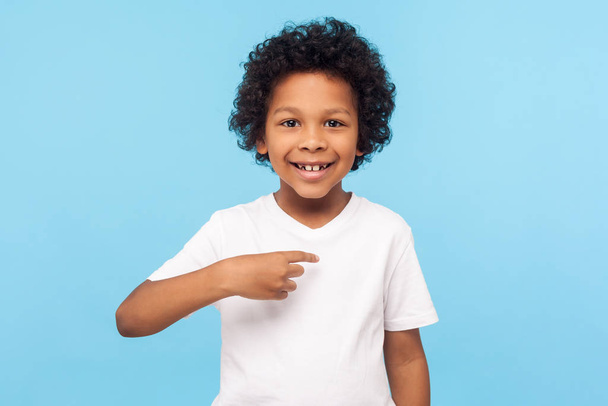 This is me. Portrait of happy preschool curly boy in T-shirt joy - Фото, изображение