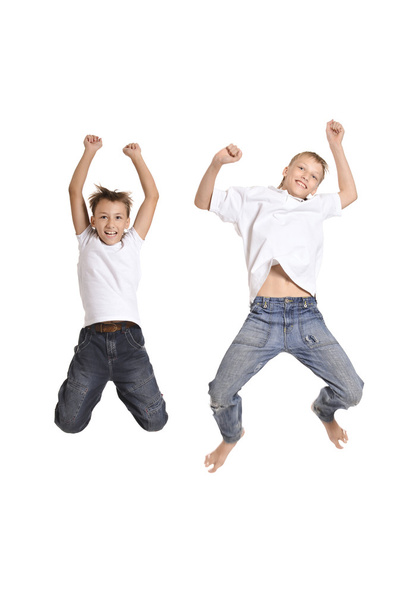 Two cheerful boys jumping - Photo, image