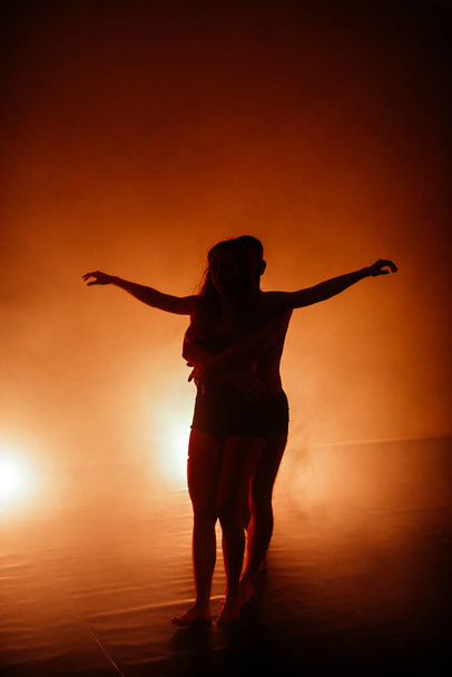 Contemporary dancing performers in dance practice class - Фото, изображение