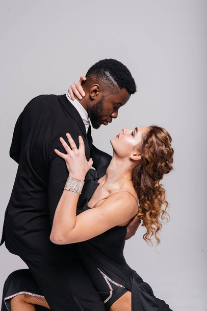 Couple dancers posing over white background. Dance school concept - Photo, Image