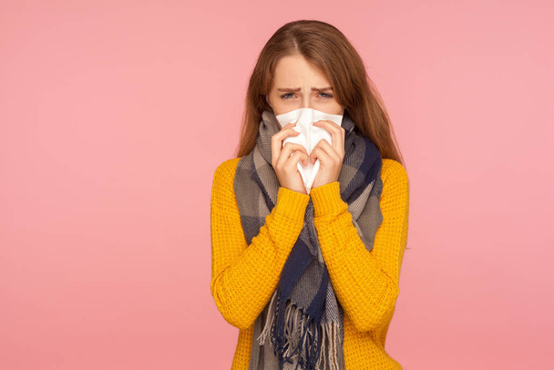 Flu season. Portrait of sick red hair girl wearing big scarf, sn - Photo, image