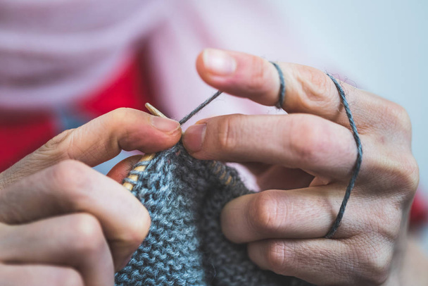 Close up of female fingers knitting at home  - Foto, Imagem